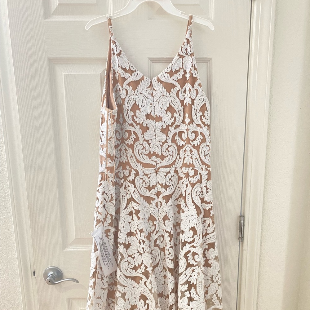 Brand new white dress from “dress the population “XL size